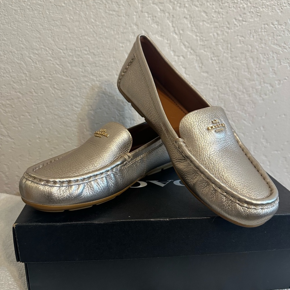 Never Been Worn Coach Loafers, Champagne color, WMS 8.5B. Beautiful shoe.